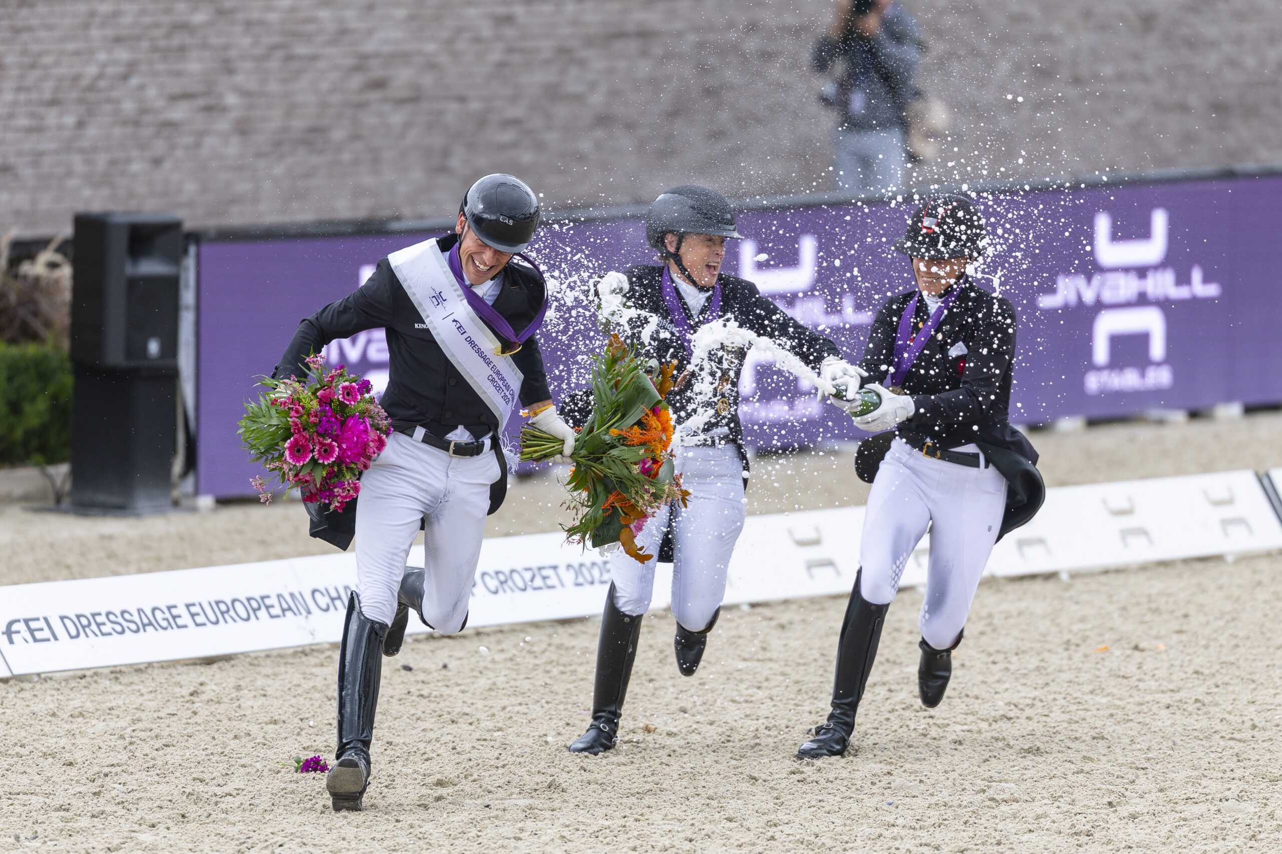Podium Grand Prix Special 1. Justin Verboomen (BEL) 2. Cathrine Laudrup Dufour (DEN) 3. Isabell Werth (GER) in the FEI Dressage European Championship - Crozet (FRA)
